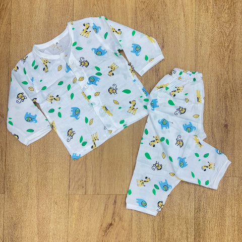 The image displays a white baby sleepsuit or pajama set, often described as a shirt and pant set or a night suit, with a colorful, all-over animal and leaf print.
