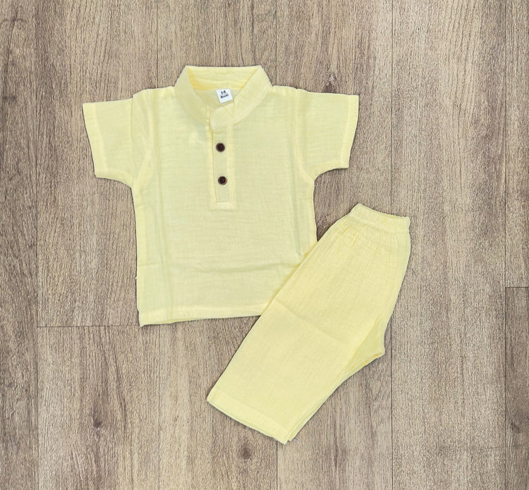 This image features is beige muslin co-ord set, consisting of a short-sleeve shirt and matching shorts.