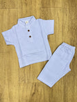 This image features is beige muslin co-ord set, consisting of a short-sleeve shirt and matching shorts.
