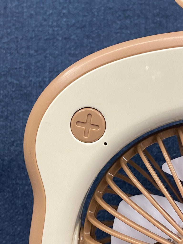 The item in the image is a "Summer Toast" mini portable fan, designed with an adorable toast shape and googly eyes.